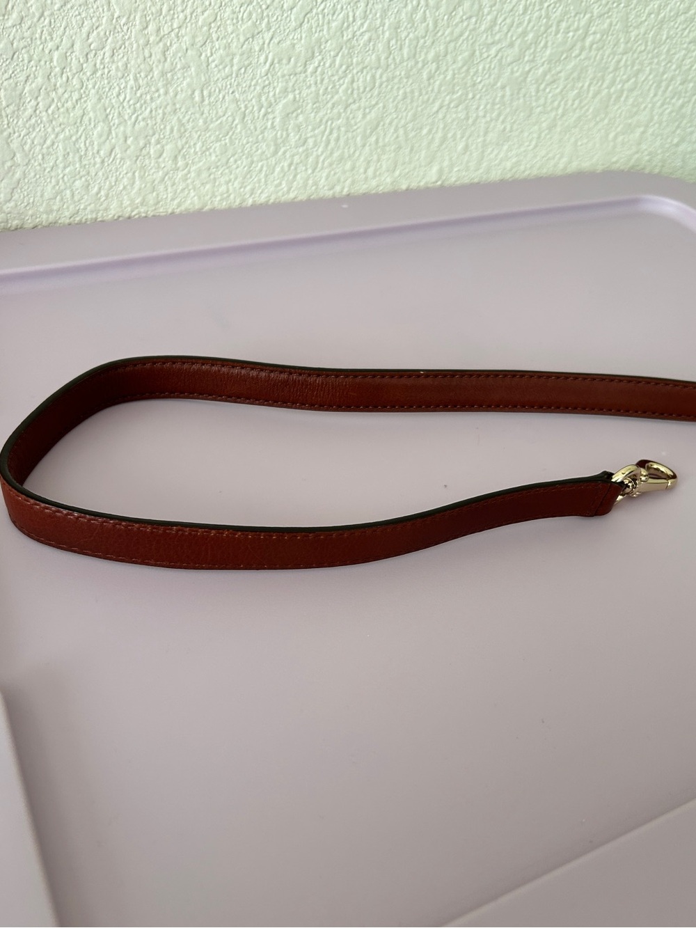 Warm brown leather purse strap